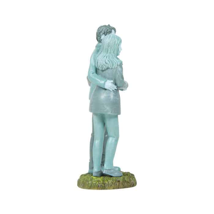 Blue toned Sculpture of a Couple Embracing from Behind Standing on a Grassy Pedestal