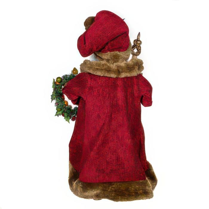 Rear View of a Plush Brown Christmas Figure Wearing a Red Robe with Fur Trim Holding a Holly Wreath a Small Brass Figure Sits on Its Shoulder