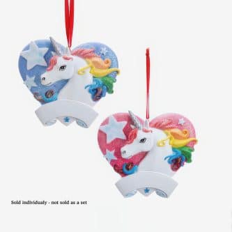 Two glittery unicorn heart ornaments with rainbow manes hanging from red ribbons, blue and pink with star patterns.