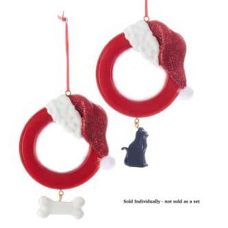 Red circular Christmas ornament with white faux fur and red glitter accents, hanging by a red ribbon, plus bone charm at bottom (sold individually).