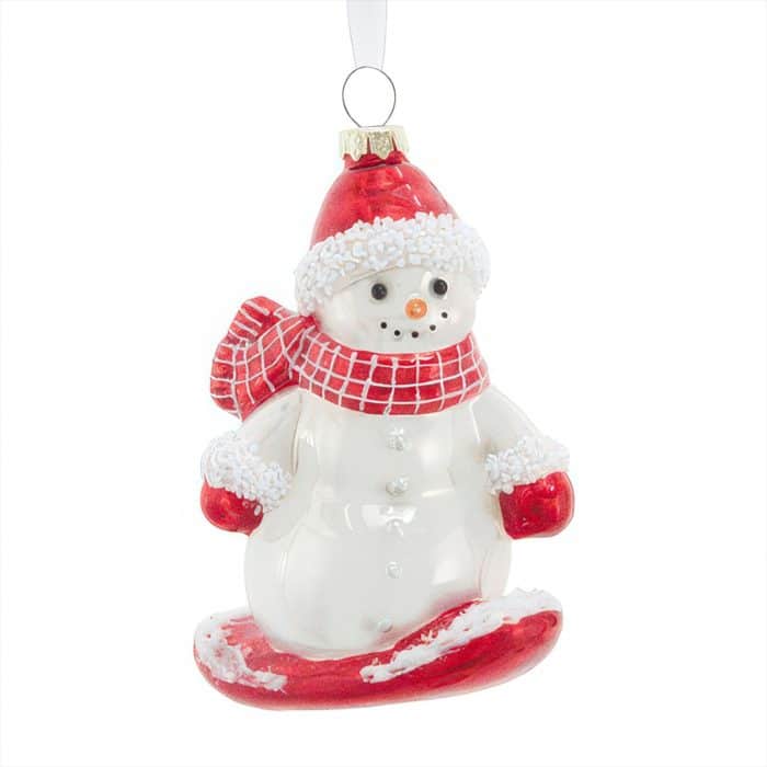 Snowman Ornament Wearing a Red Hat and Scarf Hanging by a Ribbon Against a White Background